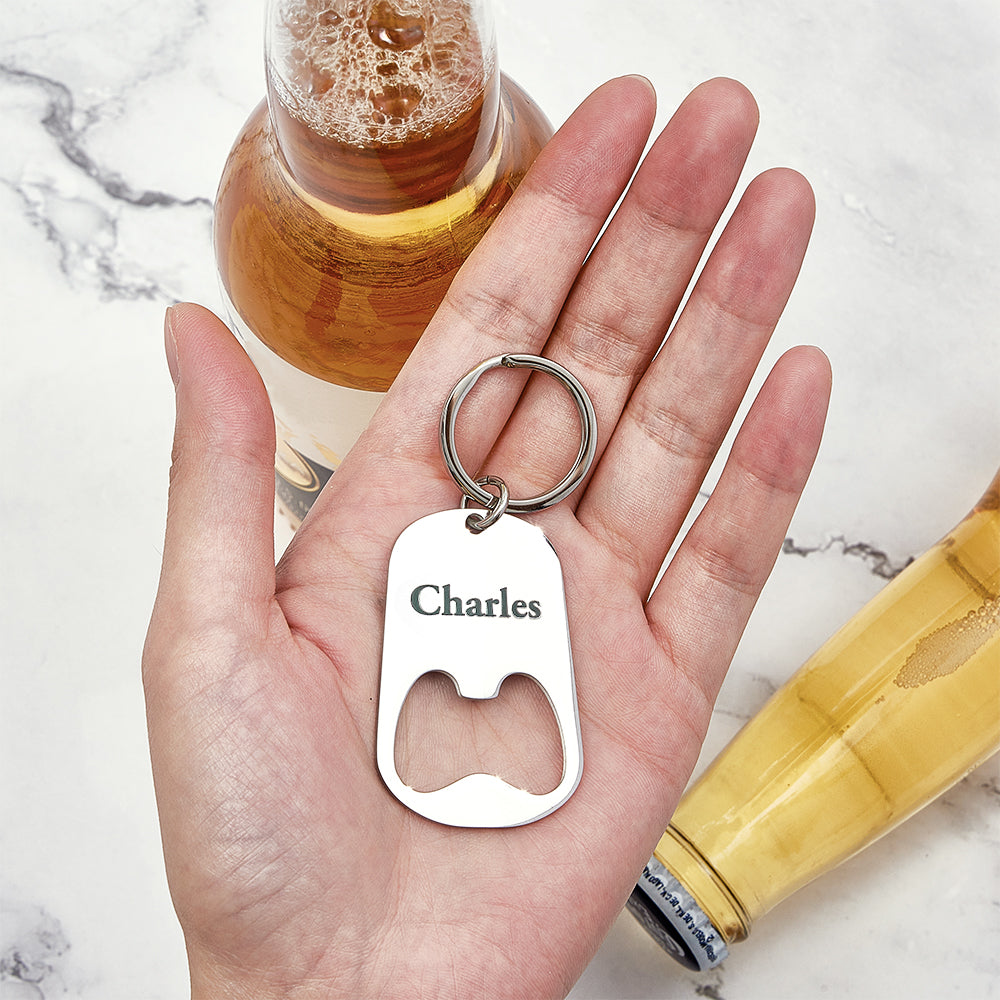 Personalised calendar keyring bottle opener held in hand to show scale and everyday use as an engraved save-the-date keepsake