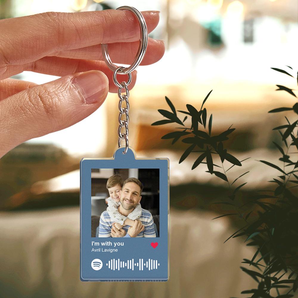 Two personalised keyrings side-by-side in different colours highlighting engraving detail and metal ring quality