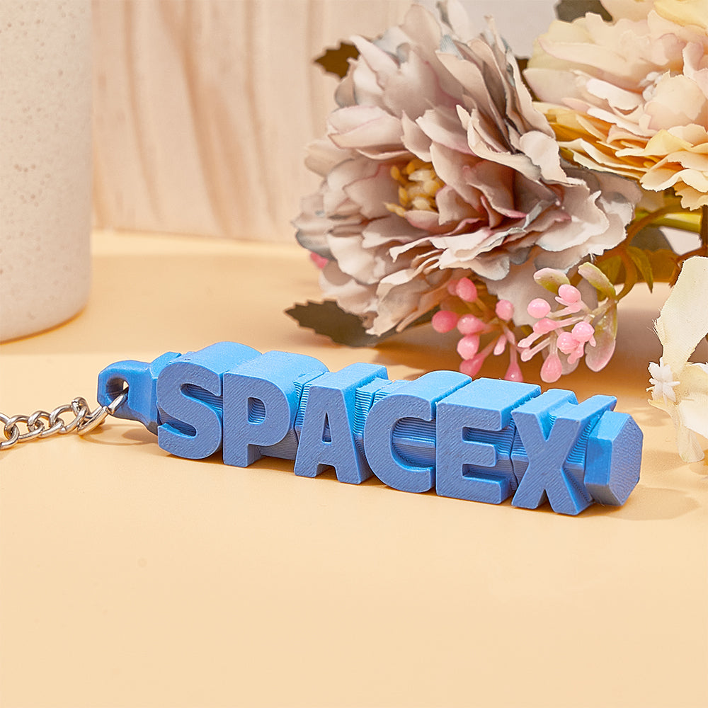 Close-up of 3D printed personalised name keychain showing split ring and detail – colourful custom keyring, sturdy PLA