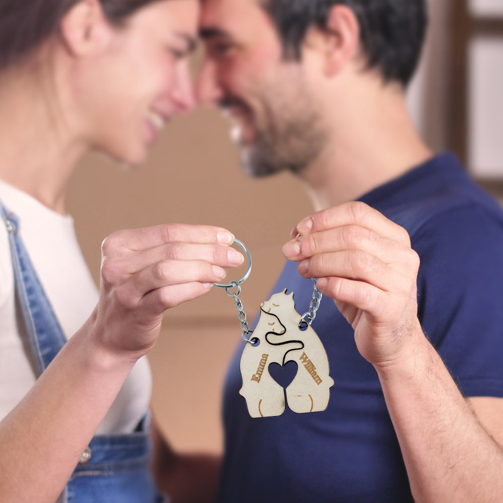 Custom matching wooden keyring close-up — engraved bear-shaped keychain with personalised names and smooth finish