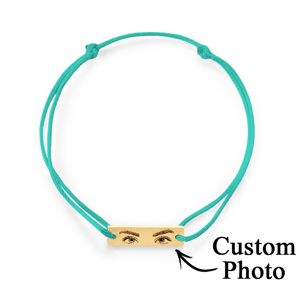 Lifestyle image of bracelet layered with other jewellery — personalised engraved stainless steel charm for everyday wear