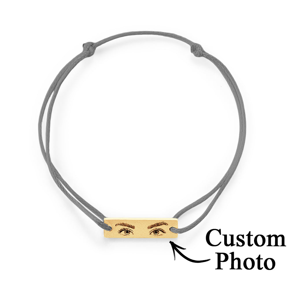 Detailed shot of hypoallergenic surgical-grade stainless steel charm on personalised eyes photo bracelet — tarnish resistant