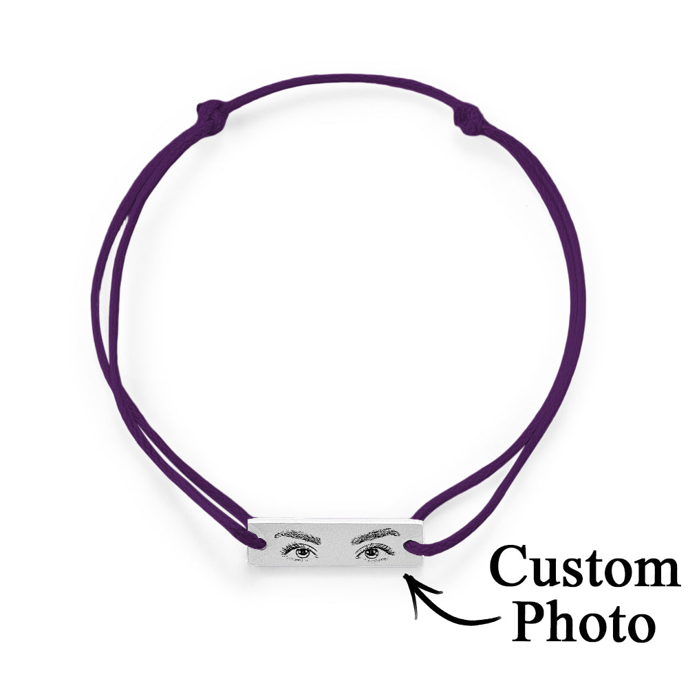 Styled product shot for Valentines and anniversaries — personalised engraved eye bracelet as an intimate love gift