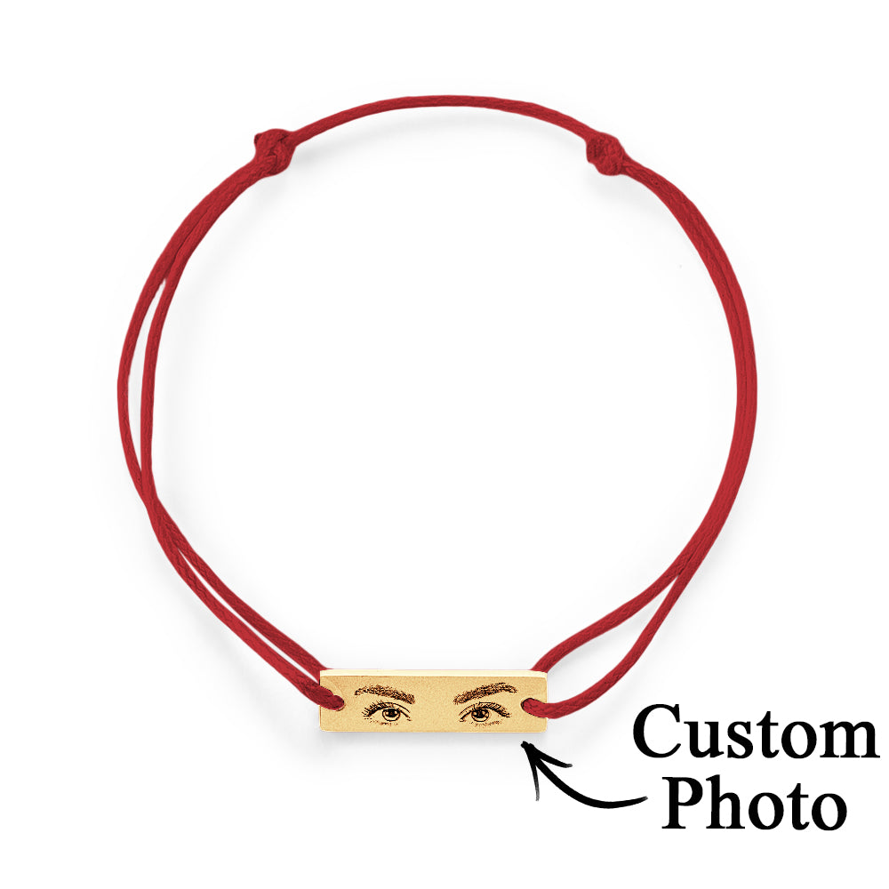 Artistic flat-lay of custom engraved charm with soft shadows to highlight micro-etched iris detail