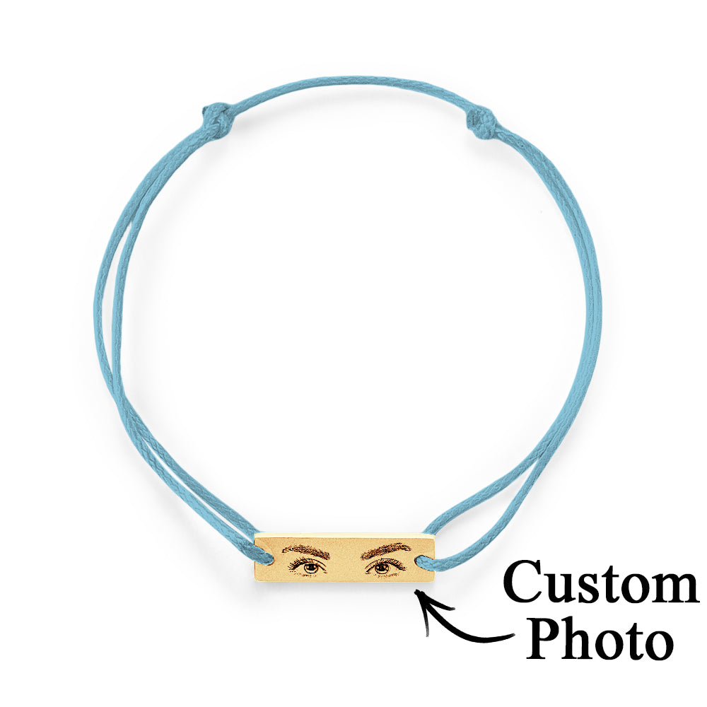 Studio image showing engraving contrast and durability of the stainless steel charm on personalised eyes bracelet