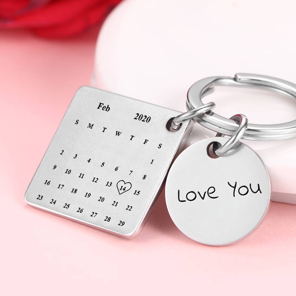 Personalised engraved keyring close-up of laser engraving on corrosion‑resistant alloy with fine mirror polish — photo calendar keychain detail