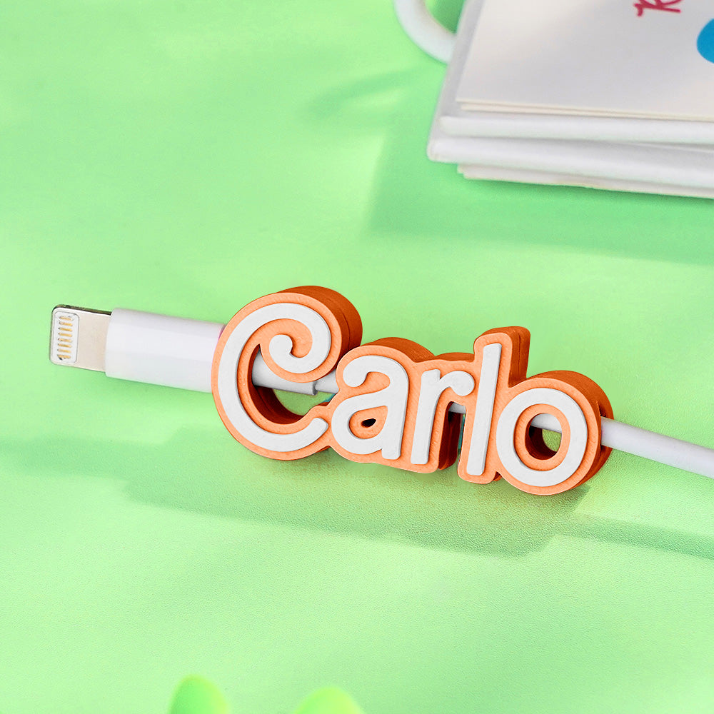 Name length variations affect final size; close-up of printed text inside the clip.