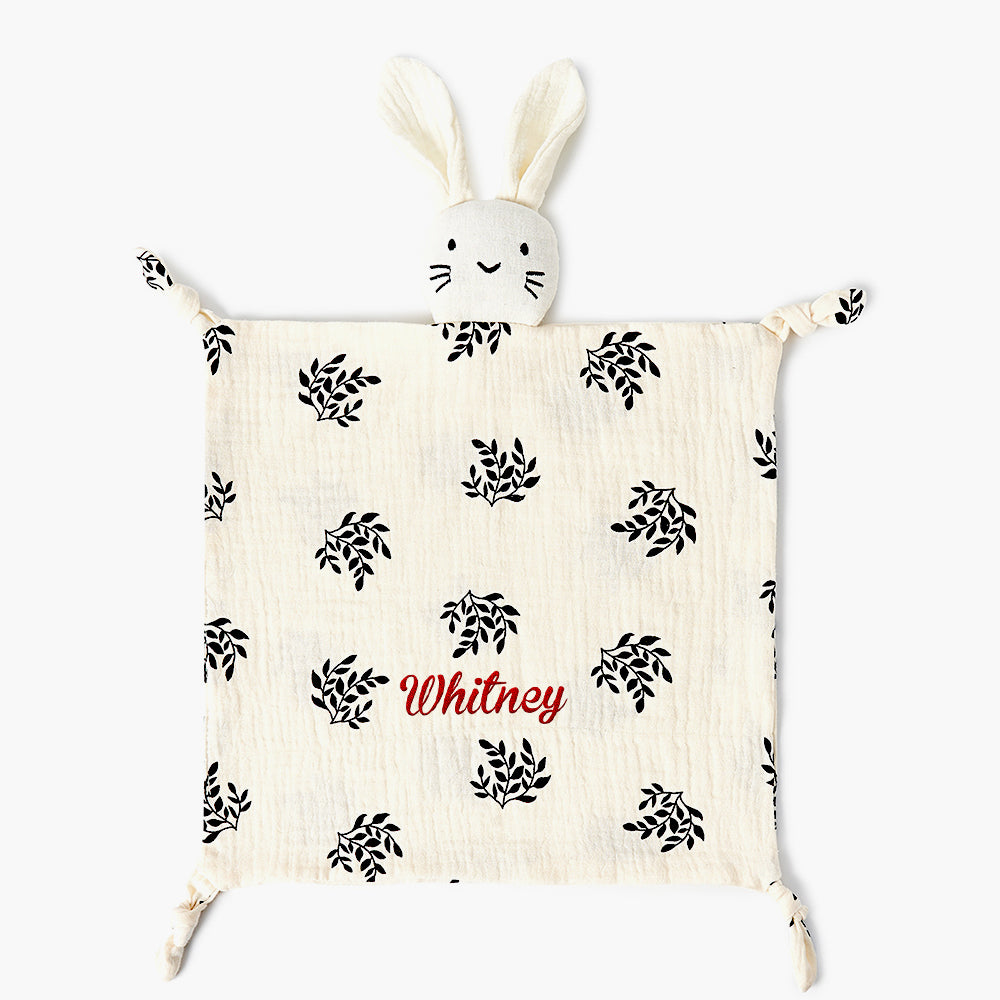 Close-up of embroidered name on personalised baby comforter