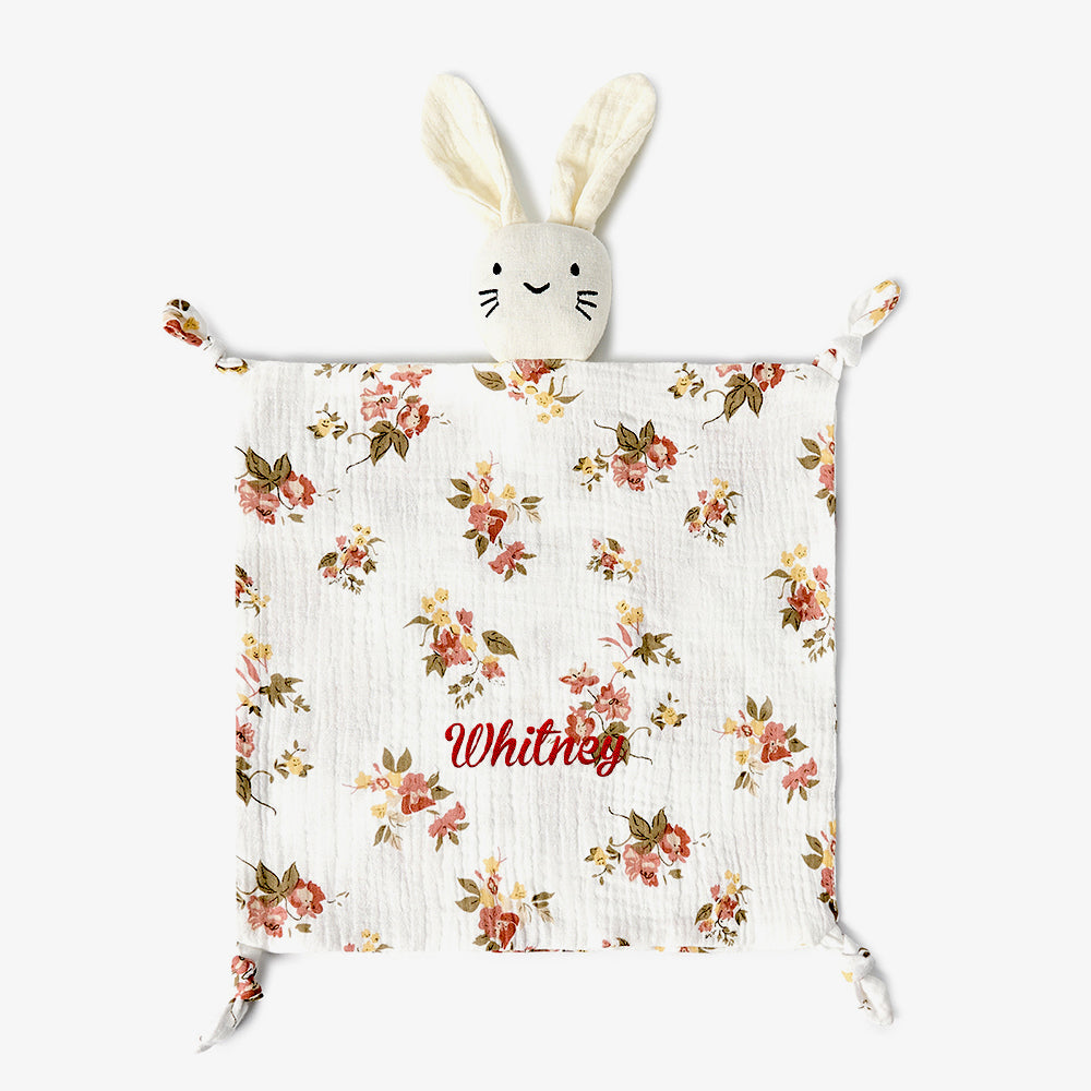 Angled view highlighting embroidery area on the baby comforter