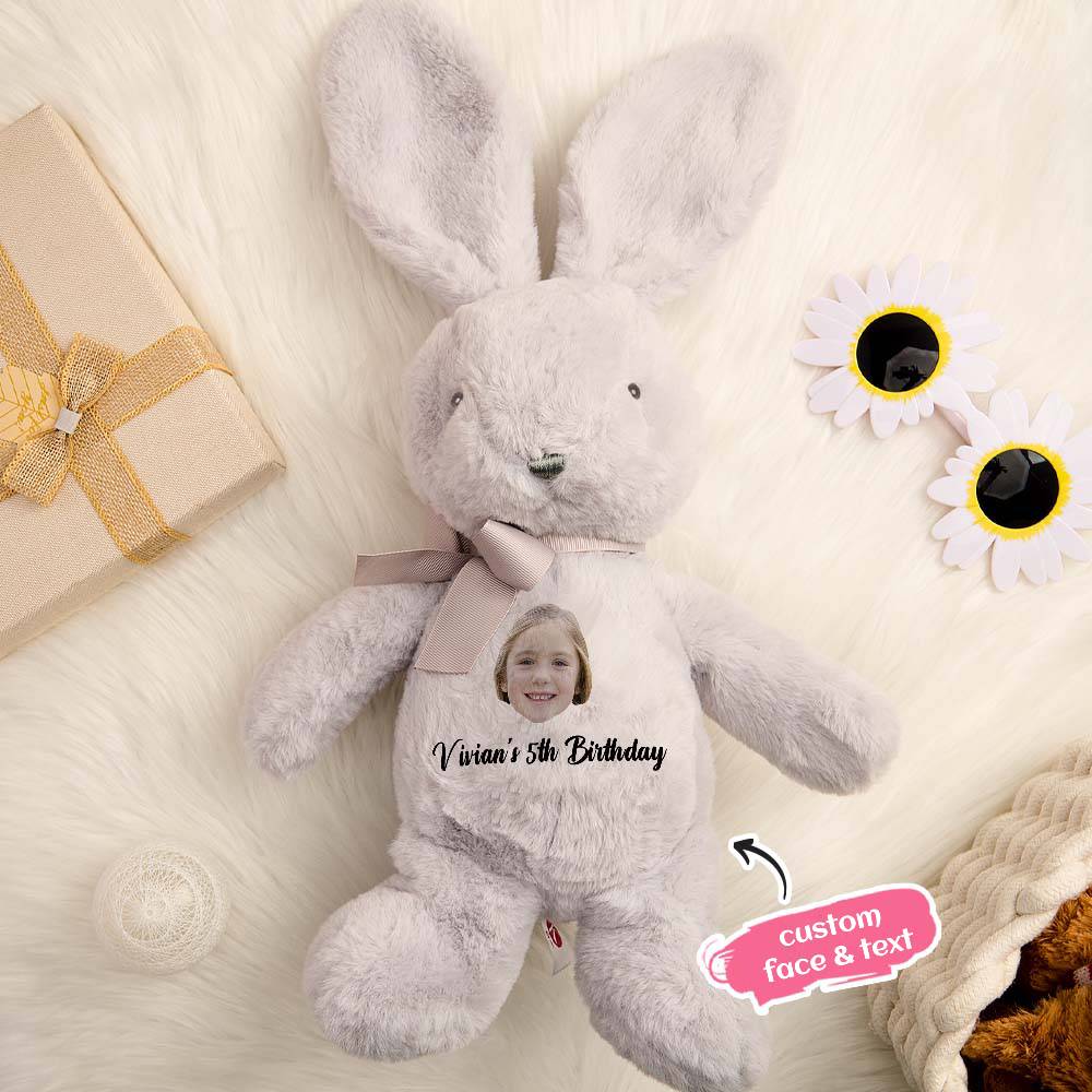 Small personalised bunny plush beside a pacifier for size reference — ideal newborn keepsake