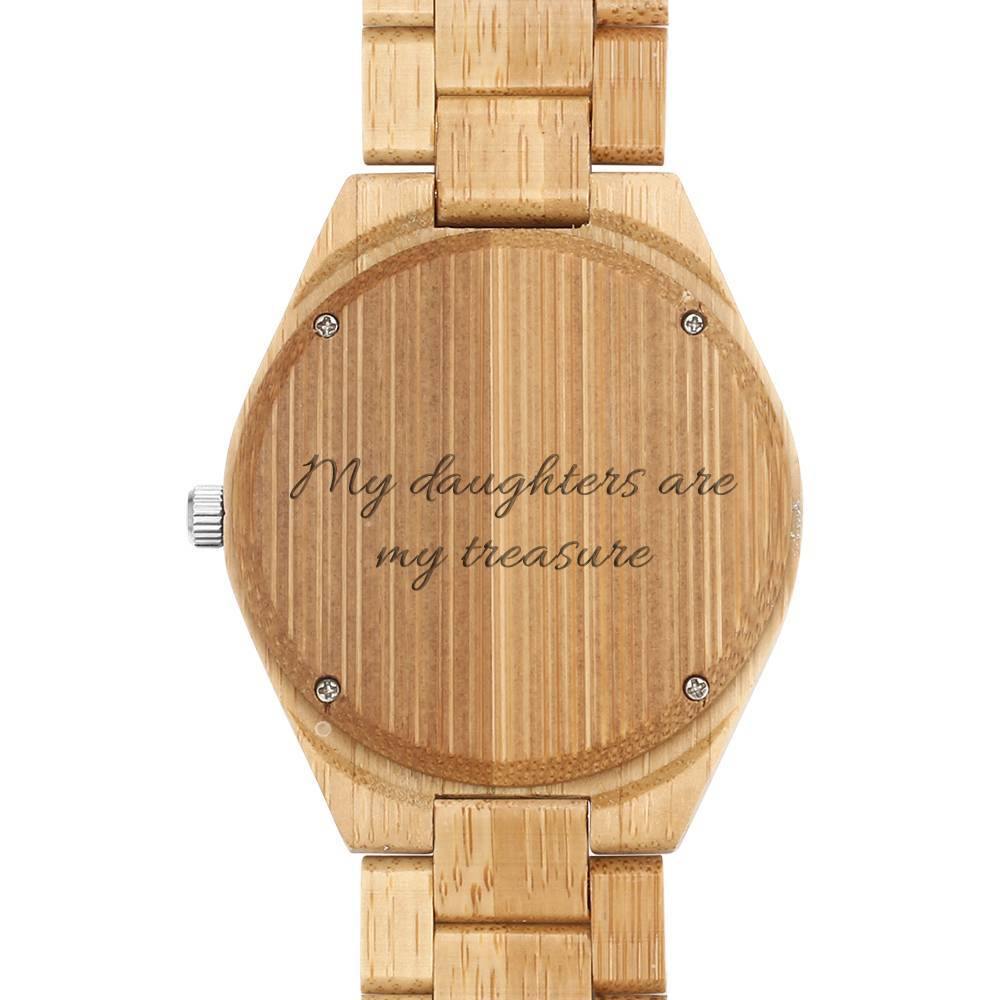 Close-up of the adjustable wooden strap and grain texture of a personalised engraved men's photo watch 45mm, demonstrating link detail and clasp