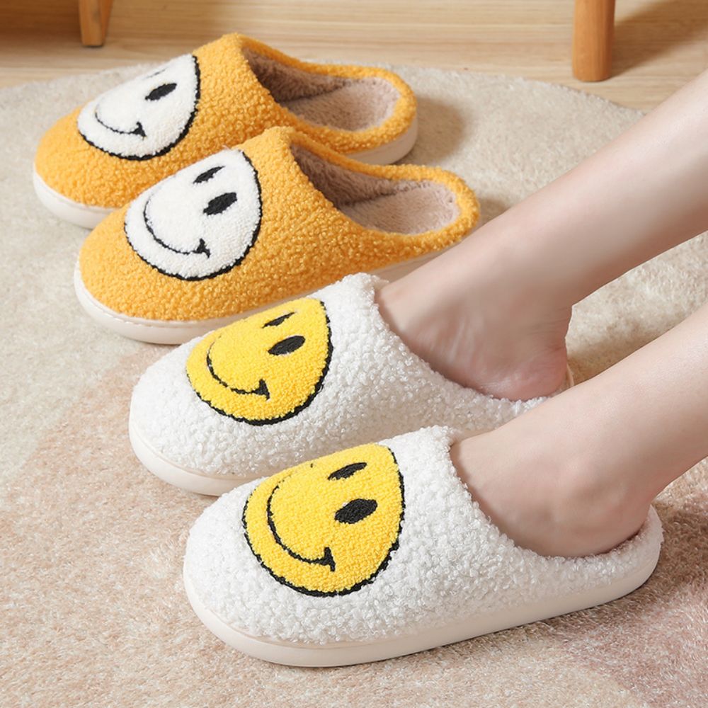 Side view of Smiley Face fuzzy slippers showing plush cotton blend upper, cushioned sponge insole and cosy design for indoor wear