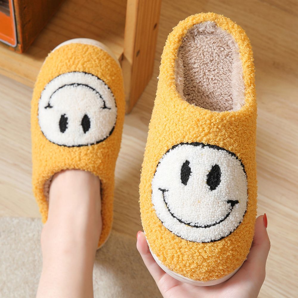 Smiley Face cosy slippers presented as a gift idea — perfect winter present for mum, partner or grandparent