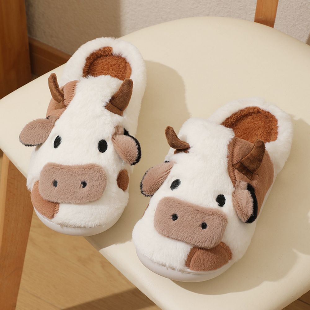 Rear and profile view showing sturdy anti-slip rubber outsole on cosy cow cartoon house slippers