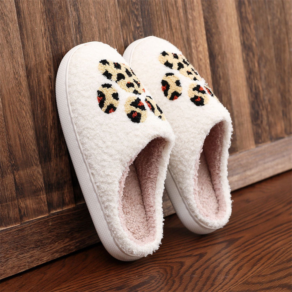 Side view of Christmas leopard paw-print cosy cotton slippers showing padded underside and plush cotton upper