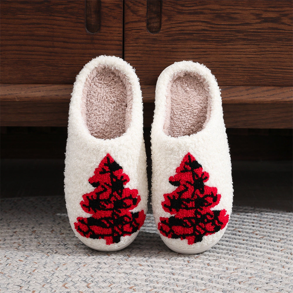 Red Christmas tree cotton slippers in plush fabric, front view of open‑mouth slip‑ons with padded interior and PVC sole for cosy indoor wear