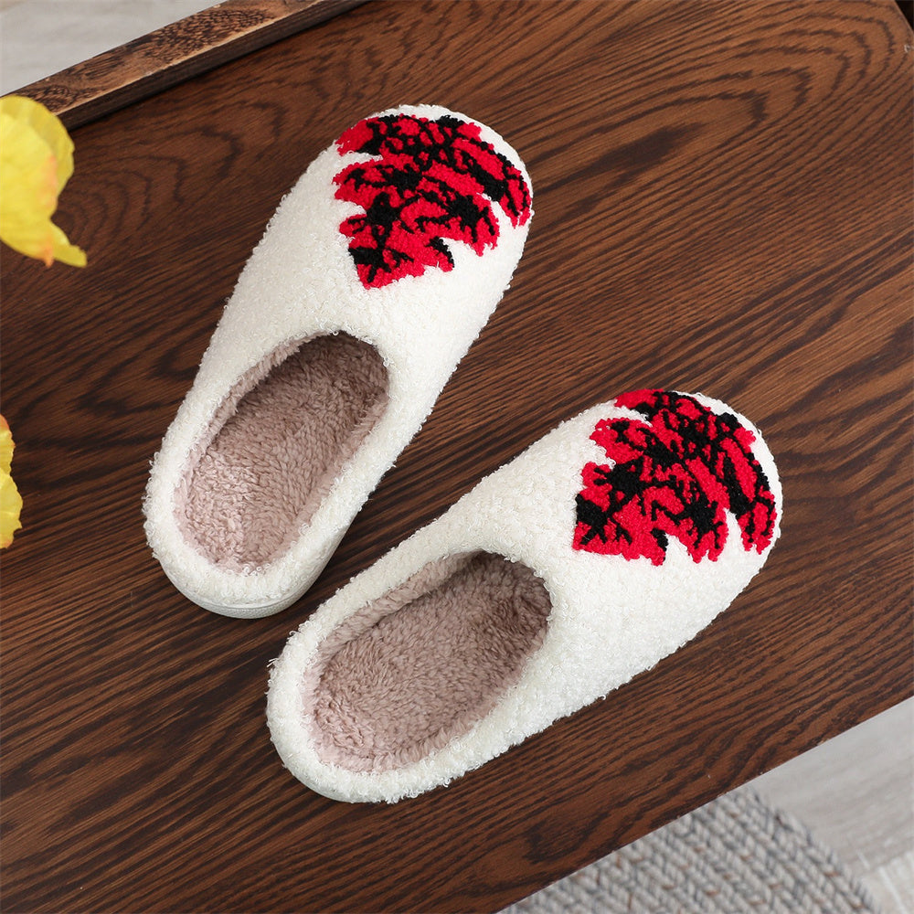 Pair of red Christmas tree cotton slippers styled as a gift idea, soft plush finish and decorative tree motif for seasonal décor