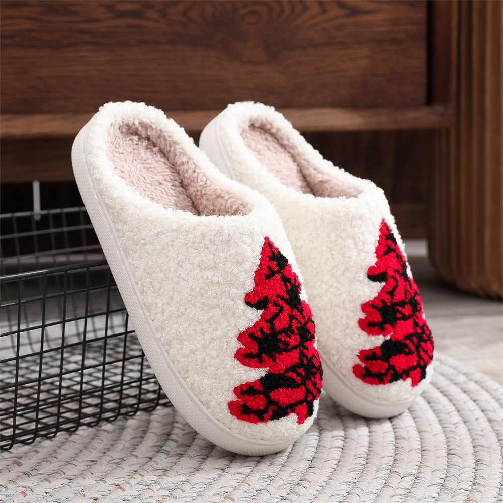 Close‑up of padded underside and textured PVC sole on red Christmas tree cotton slippers for reliable indoor traction and comfort