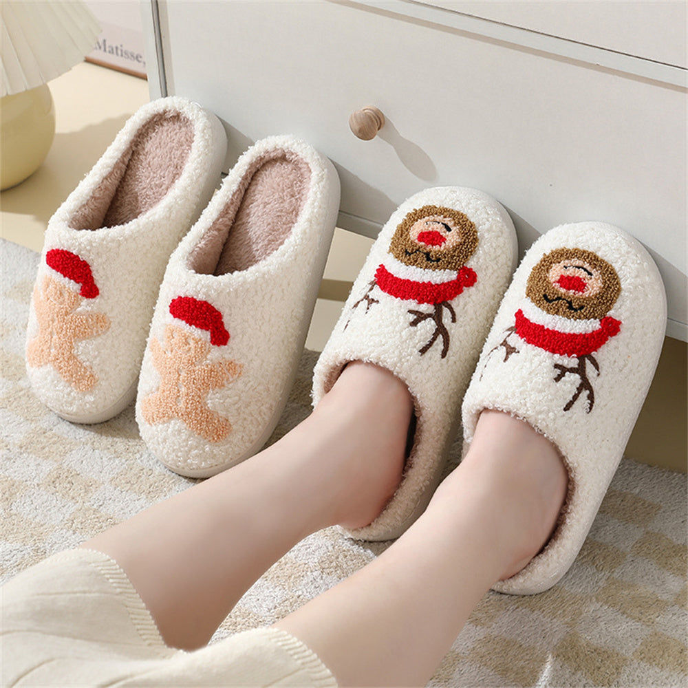 Side-angle of Santa and gingerbread plush slippers highlighting roomy slip-on shape and padded support for toes and heels