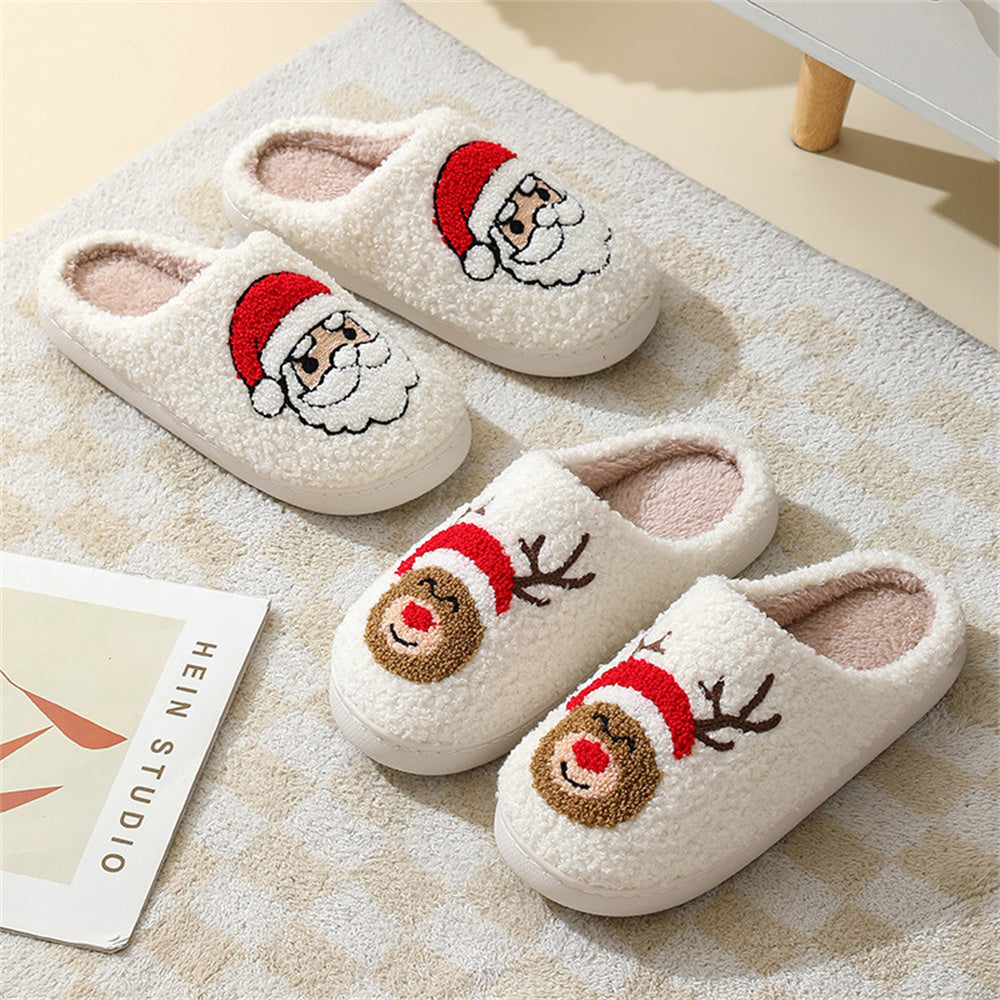 Pair of gingerbread man slippers on a sofa showing cushioned inner sole and soft plush upper for lounging at home