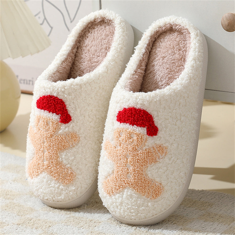Side-angle of Santa and gingerbread plush slippers highlighting roomy slip-on shape and padded support for toes and heels