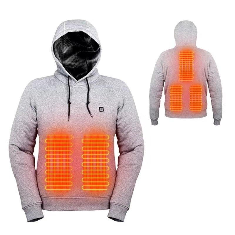 Hands demonstrating easy on off control and temperature cycling on the chest mounted button of the heated hoodie