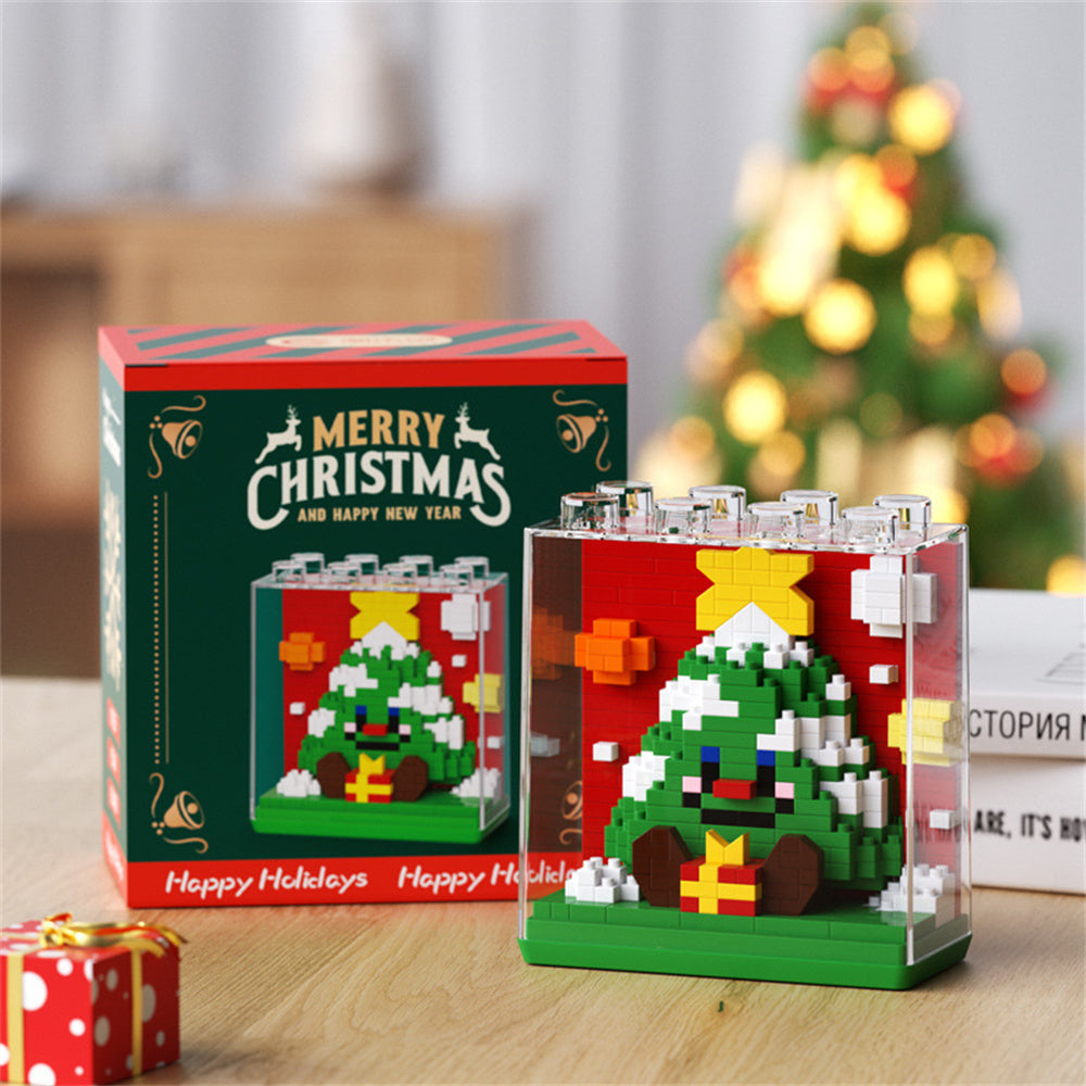 Compact Christmas building block set shown in a child's hand (8.5cm x 4cm x 8.6cm) — ideal gift for kids