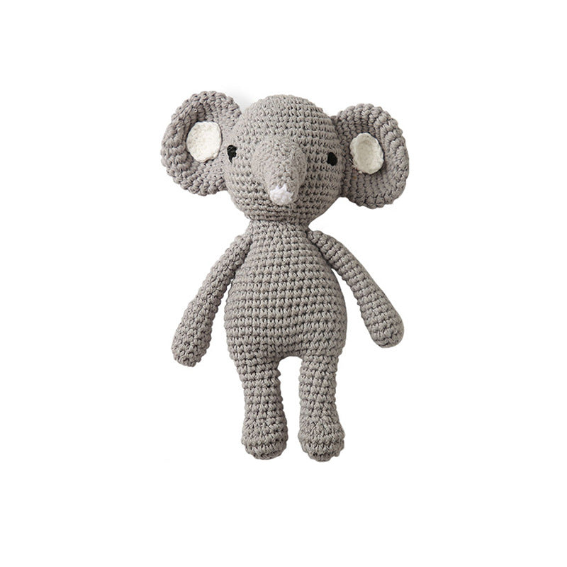 Natural wooden ring detail with smooth finish on knitted baby rattle – wipe-clean, eco-friendly component