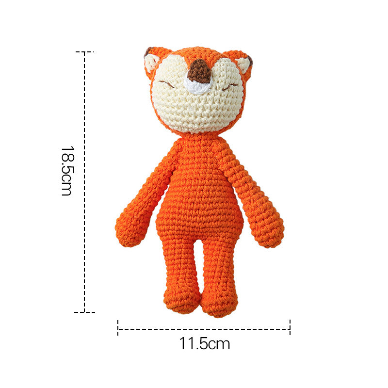 Studio shot of knitted animal baby rattle as a charming photography prop and keepsake gift for new parents