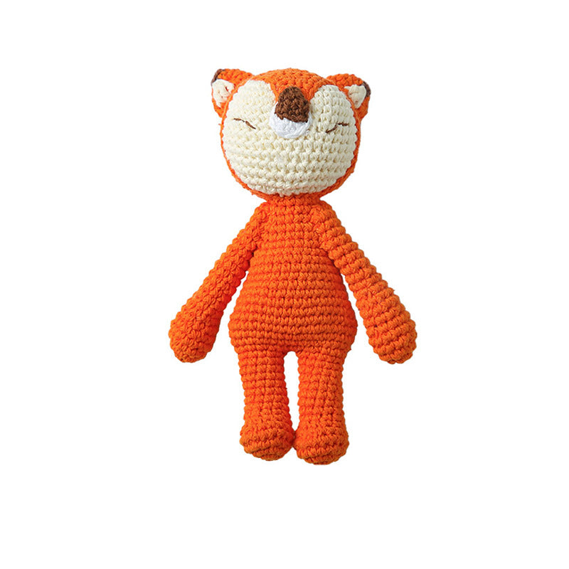Gift-ready presentation of a handmade knitted rattle with tag – perfect for baby showers, christenings and birthdays