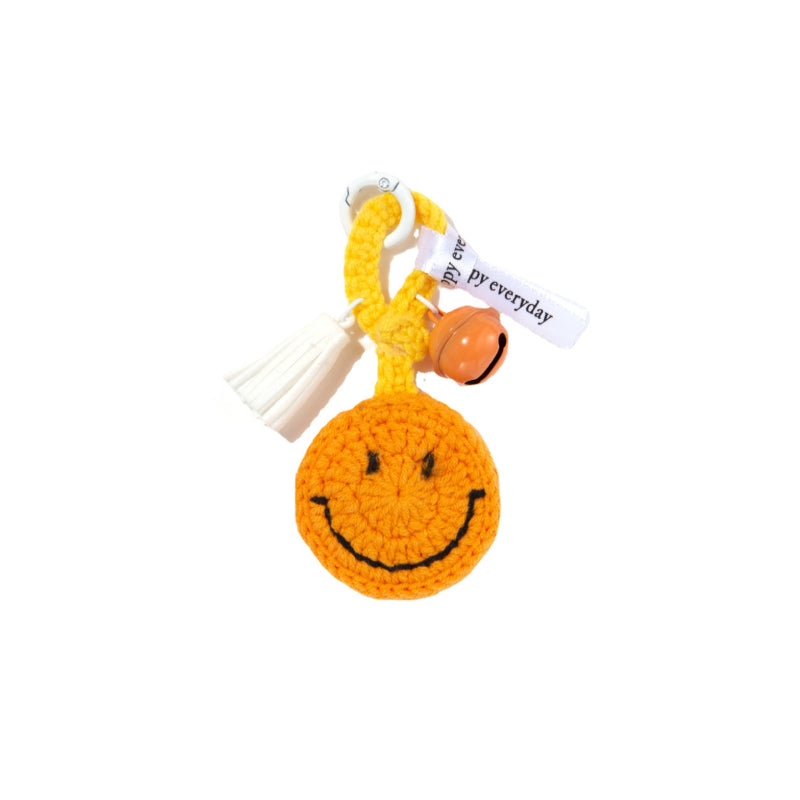 Back view of hand-knitted crochet smiley keyring showing neat stitching and metal ring attachment