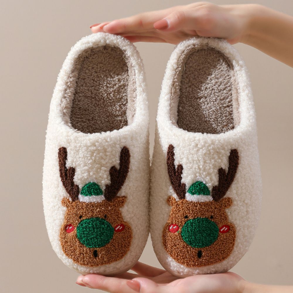On‑foot view of Christmas Reindeer Plush Slippers — open‑mouth slip‑ons for easy wear, comfy for lounging by the fire