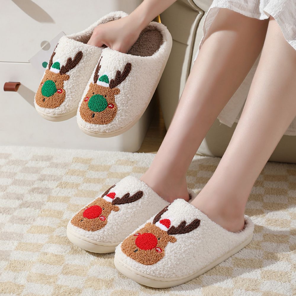 Underside view showing TPV durable non‑slip sole and cushioned padding of Christmas Reindeer Plush Slippers for secure indoor grip