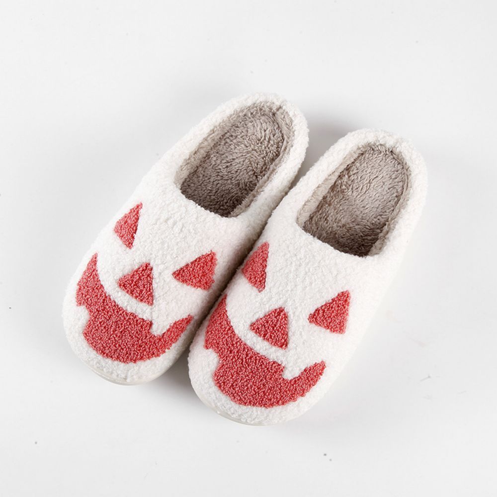Model wearing Halloween Pumpkin Slippers in a cosy home setting — novelty pumpkin slip‑ons perfect for cosplay, parties and casual wear