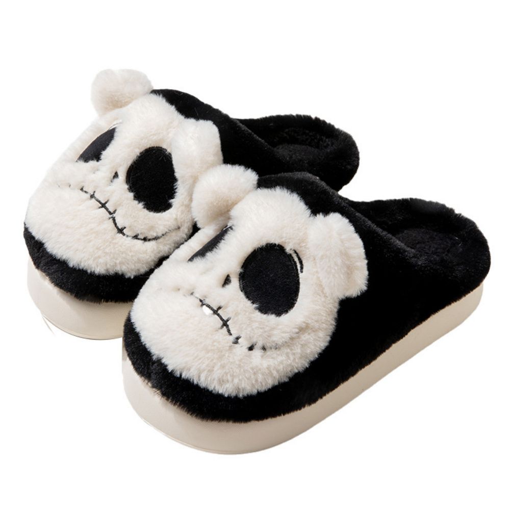 Top view of unisex Halloween skull slippers showing pronounced skull face and comfortable slip-on EVA sole, ideal for adult costume wear and novelty gifts