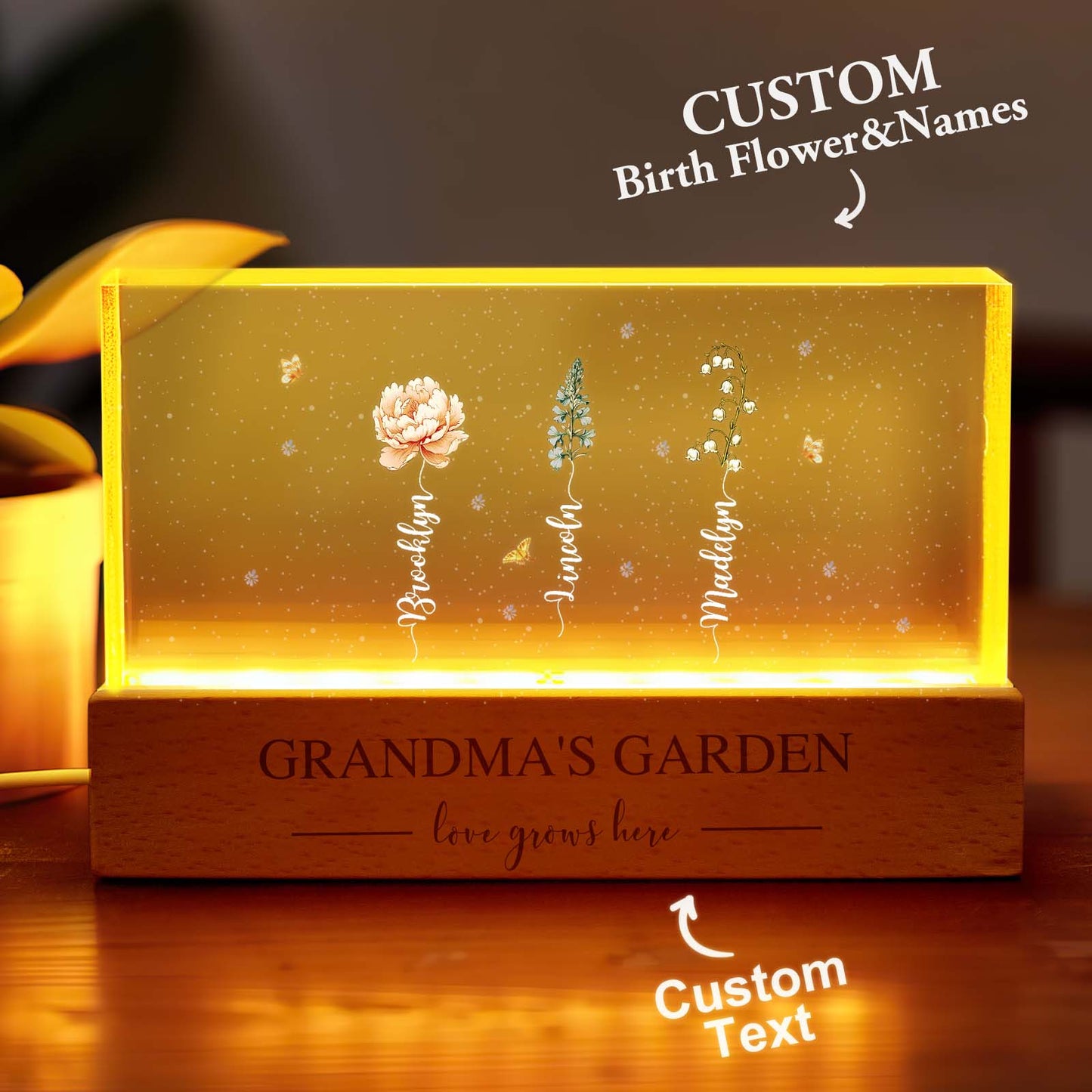 Close-up of personalised engraving and delicate birth flower detail on Grandma's night light