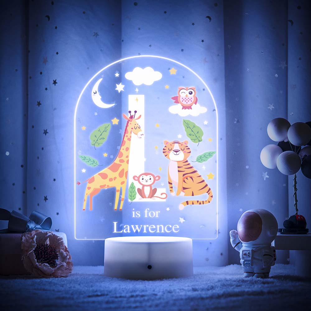 Engraved acrylic slide showing animal alphabet 'K' design with custom name example — personalised nursery lamp