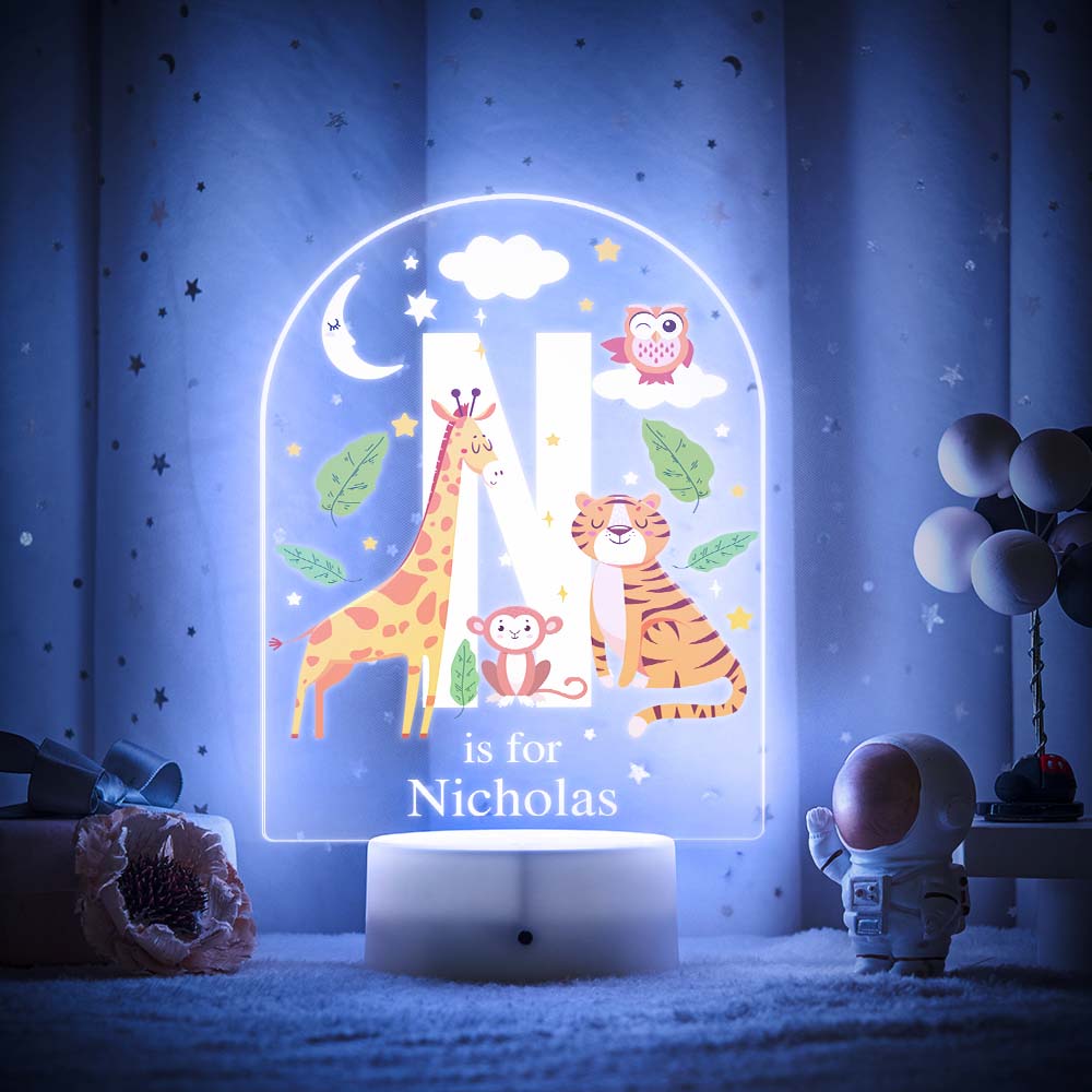 Engraved acrylic slide showing animal alphabet 'M' design with custom name example — personalised nursery lamp