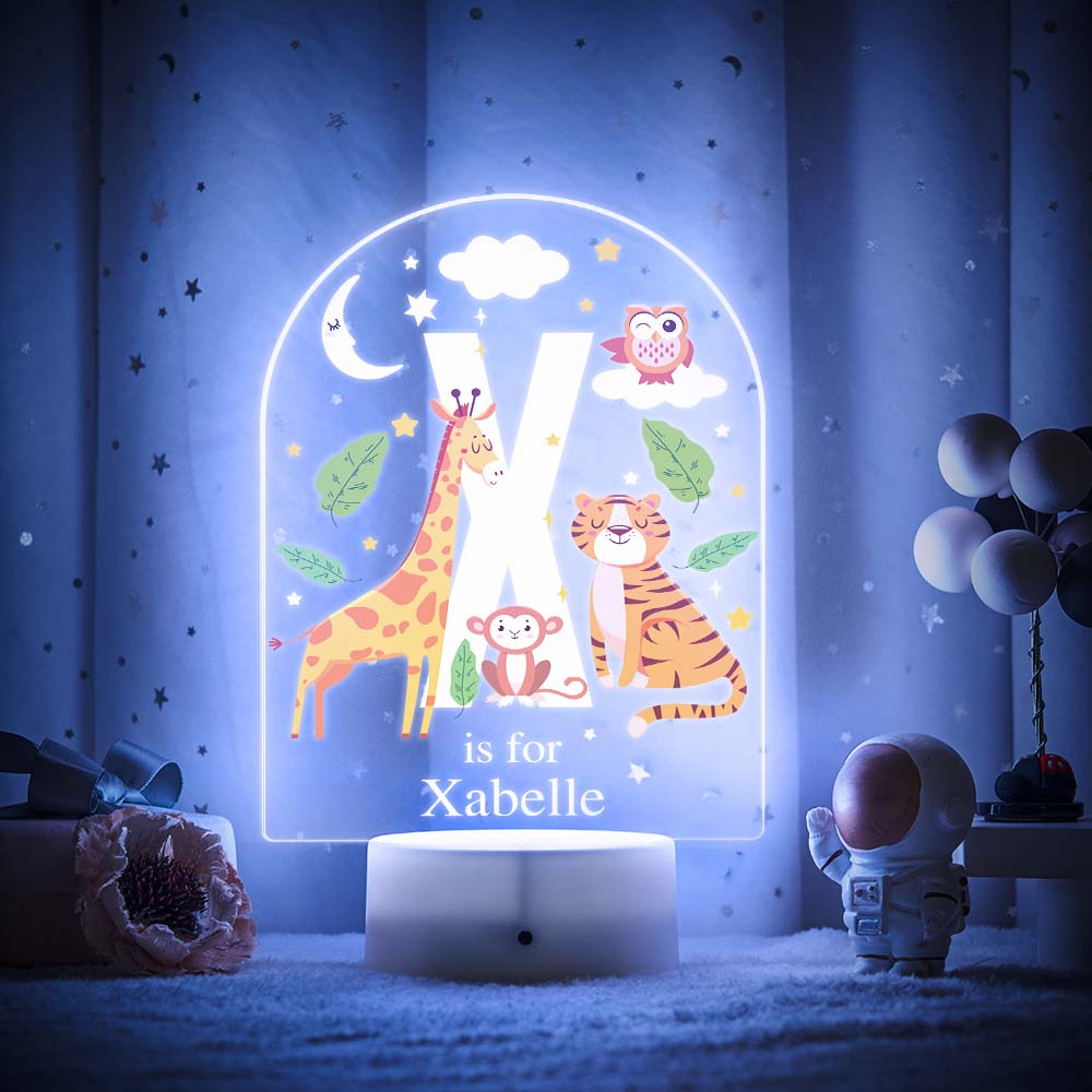 Engraved acrylic slide showing animal alphabet 'W' design with custom name example — personalised nursery lamp
