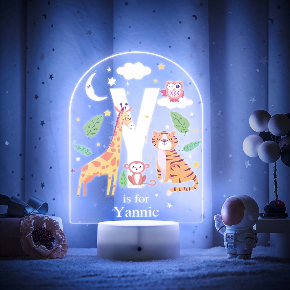 Engraved acrylic slide showing animal alphabet 'X' design with custom name example — personalised LED night light