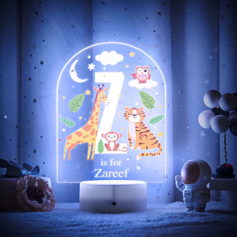 Engraved acrylic slide showing animal alphabet 'Y' design with custom name example — personalised nursery lamp
