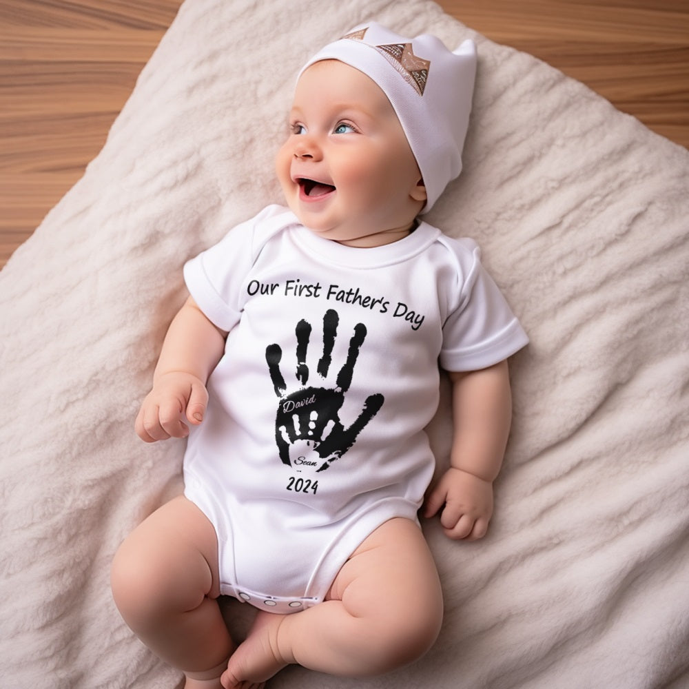 Close-up of personalised baby onesie handprint design on breathable cotton — ideal personalised baby onesie for Father's Day photos