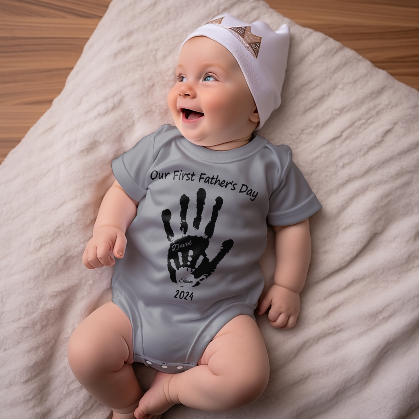 Flatlay of custom baby handprint tee, personalised with name or short message — thoughtful first Father's Day gift for babies