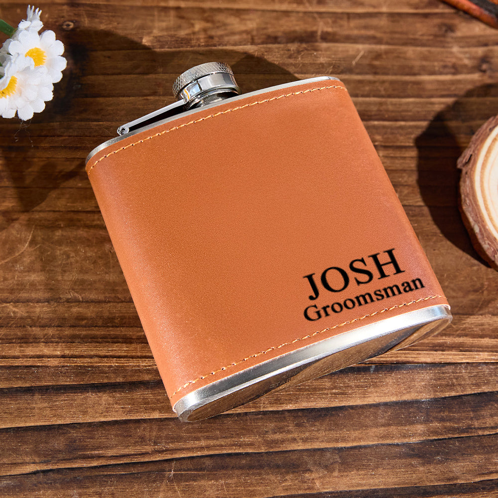 Personalised engraved 6oz whiskey flask slipped into a jacket pocket — compact stainless-steel flask for groomsmen and everyday carry