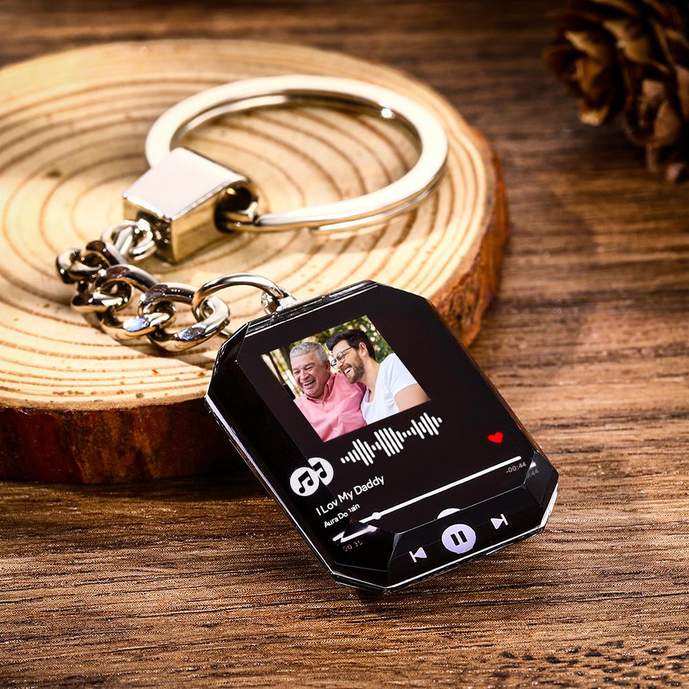 Crystal photo keychain hanging from keys — personalised anniversary gift with scannable music code