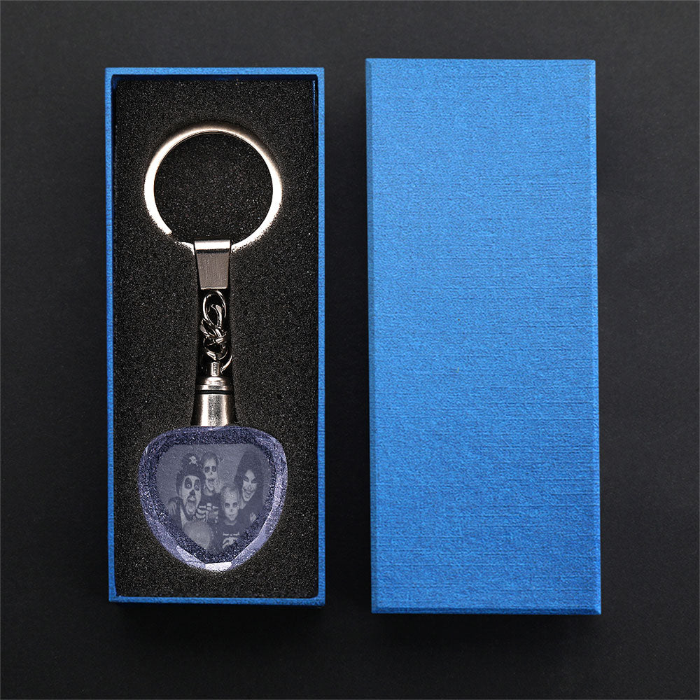 Close-up of laser-etched double-sided portrait and personalised text on clear heart crystal keyring with sturdy metal ring