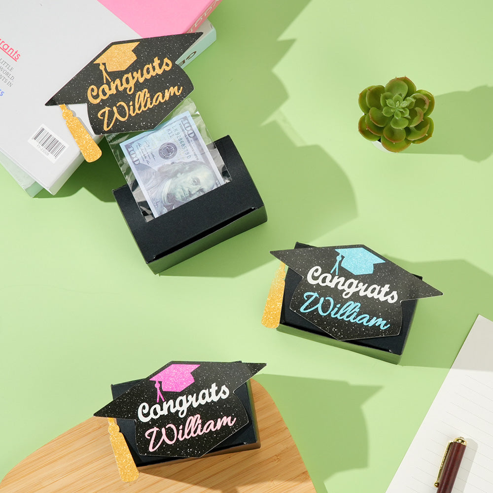 Gift-ready personalised graduation money box filled with notes and gift cards, ideal graduation gift