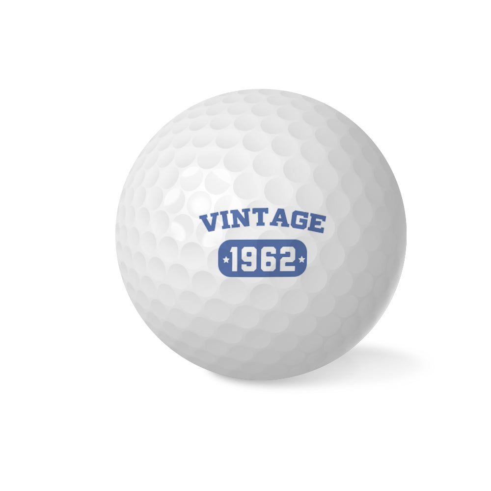 Collection of personalised vintage golf balls showing different custom names and retro designs — ideal personalised golf gifts for dad, husband or golf enthusiast