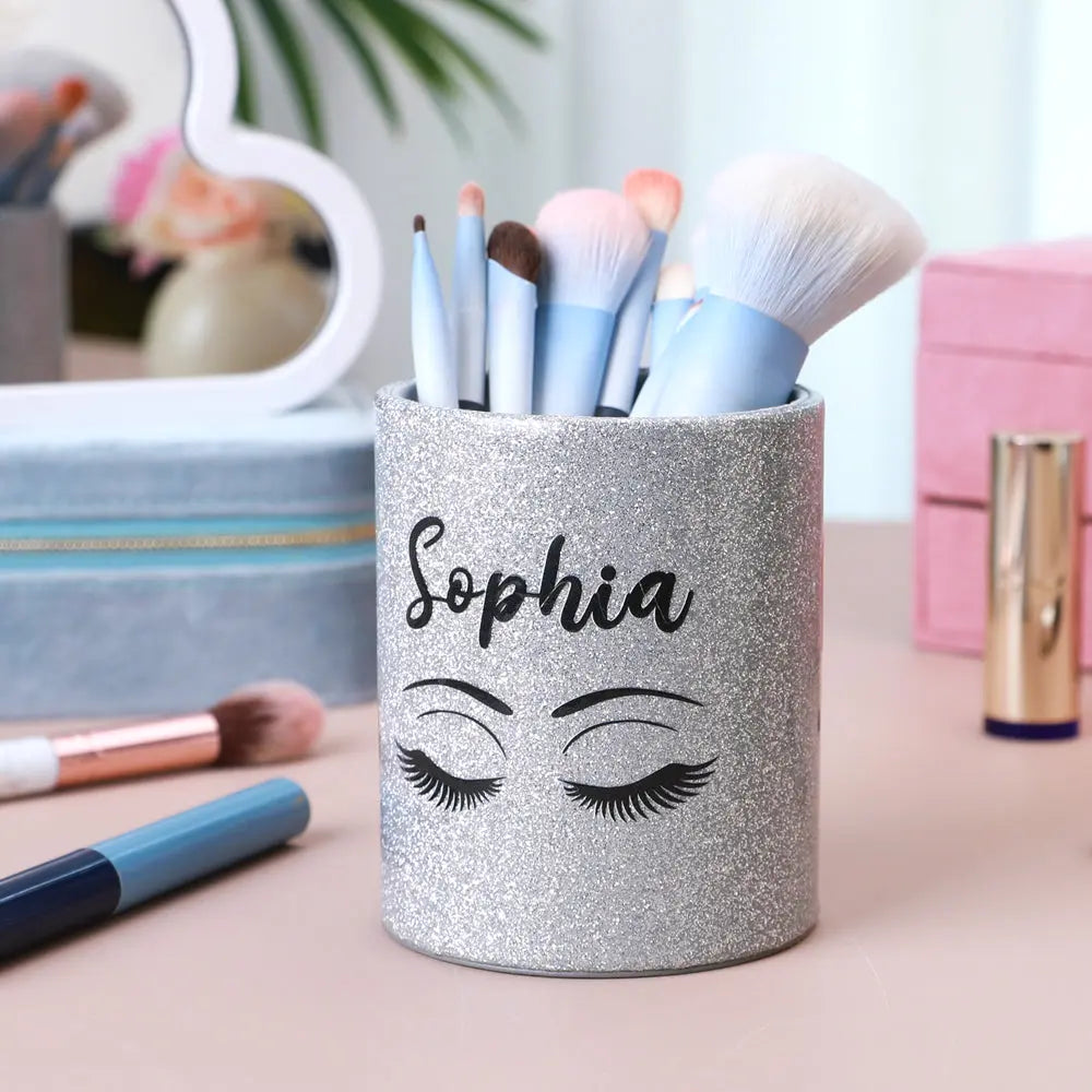 Close-up showing different custom text styles on the glitter panel of a personalised brush cup, demonstrating custom name and short wording options