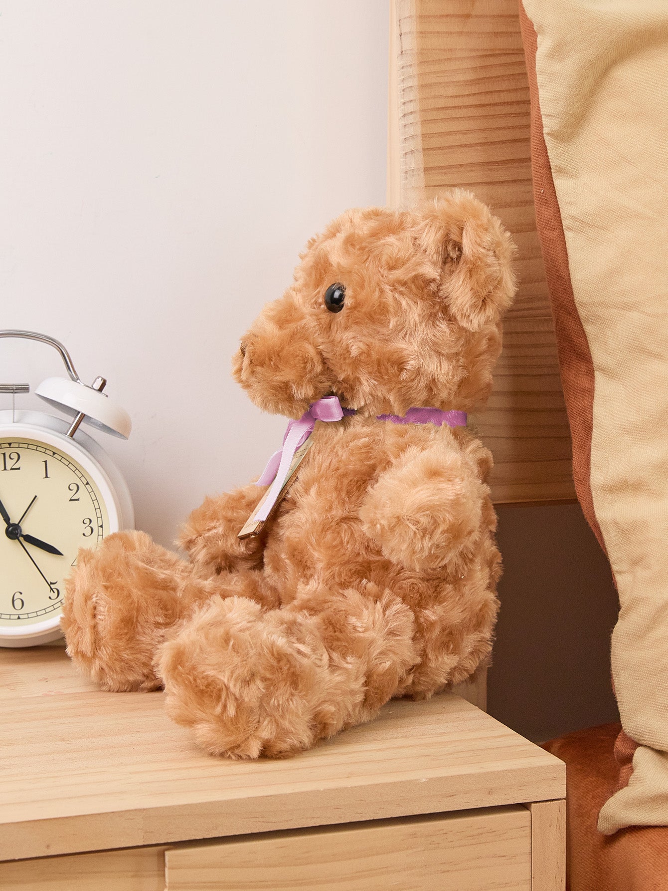 Flat-lay of personalised birth announcement bear showing embroidered weight, length and time — keepsake product shot